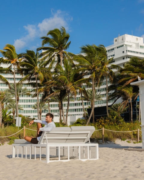 Model-sits-on-cabana_Chateau-in-background_Outsmart-Labs_2023